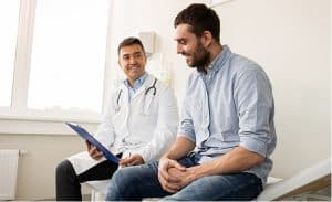 A man and a doctor are sitting in a room